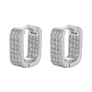 Close-up of rectangular silver earrings featuring full micro-pave cubic zirconia crystals