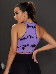 Detail of seamless tie-dye sports vest featuring ribbed knit texture and racerback design