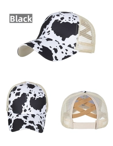 Detail of baseball cap with cow print pattern and criss-cross elastic ponytail hole back