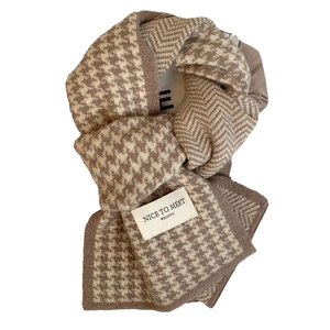 Classic brown and beige houndstooth knit scarf with chic decorative patch detail