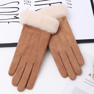 Detail view of brown faux suede winter gloves with beige plush cuffs on white background