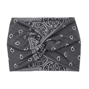 Detail of dark grey paisley print headband with soft knotted fabric texture
