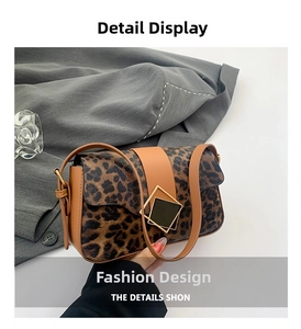 Detail of leopard print shoulder bag featuring gold geometric buckle and brown trim