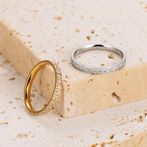 Eternity rings in gold and silver finish with full pave cubic zirconia on stone base