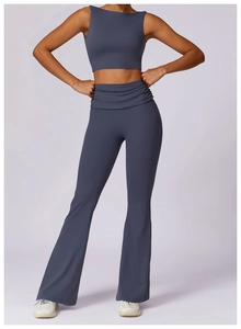 Detail of high-waist flared yoga pants with ruching in brushed dark grey-blue fabric