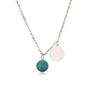 Close-up of a silver stainless steel necklace with turquoise bead and round coin pendant