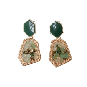 Vintage geometric drop earrings with green stones and gold irregular frame on white background