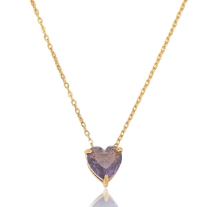 Detailed macro view of heart-shaped purple gemstone pendant on fine gold chain