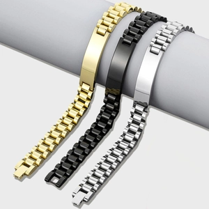 Close-up of gold, black and silver stainless steel watch band bracelets on a stand