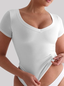 Close-up of white V-neck bodysuit with a slim-fit design on model for a trendy summer look