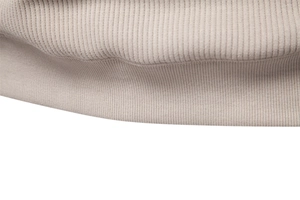 Close-up of khaki ribbed knit hem and texture on men's stand collar sweatshirt