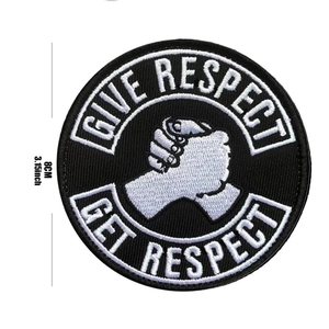 Detailed view of an 8cm round embroidered patch with GIVE RESPECT GET RESPECT text