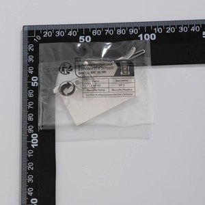 Detailed view of a 4.5cm polished silver metal hairpin measured on a metric scale ruler