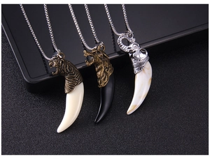 Detail view of retro animal head necklaces with wolf, tiger, and elephant pendants