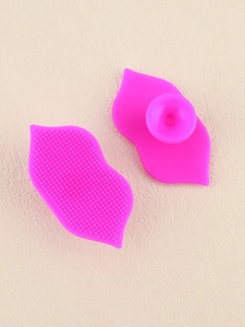Detail view of silicone lip brushes showing soft bristles and suction cup base