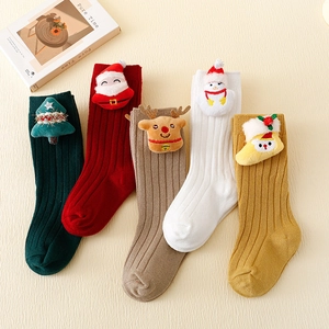 Set of Christmas-themed baby socks with 3D plush holiday dolls in various colors