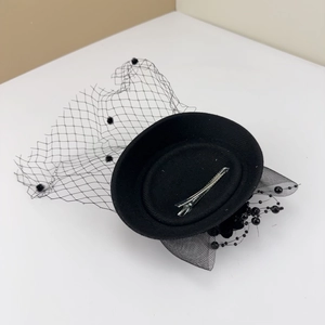 Elegant black vintage pillbox hat with mesh veil, beads, and clip for formal dresses