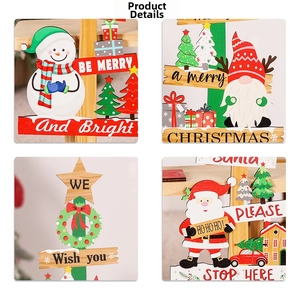 Detail of wooden Christmas table decor with hand-painted Santa and snowman motifs