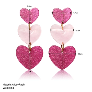 Three-tier pink glitter heart drop earrings in acrylic resin with size and weight info