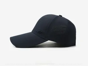 Detail of navy blue baseball cap with laser-cut ventilation holes and embroidered logo