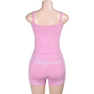Rear view of pink ribbed two-piece set featuring Happiness embroidery on high waist shorts