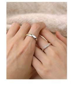 Macro detail of S925 sterling silver wheat ear couple rings featuring cubic zirconia