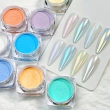 Macro shot of colorful pearlescent nail powder pots with mermaid shimmer finish effects