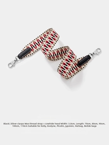 Detail of 3.8cm woven shoulder strap with red geometric pattern and silver swivel hook