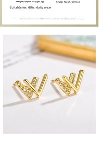 Macro shot of gold V-shaped stud earrings with sparkling pavé cubic zirconia details