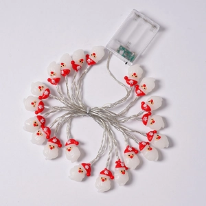 Detail of Santa Claus LED string lights with transparent battery box showing switch modes
