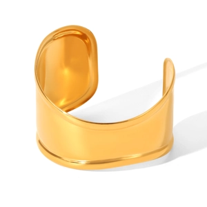 Minimalist wide open cuff bangle in polished gold finish stainless steel on white background