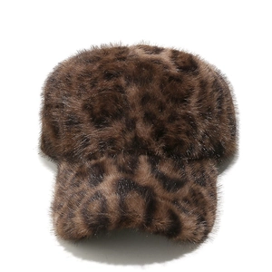 Close-up of fluffy faux fur texture and leopard pattern on the warm baseball cap