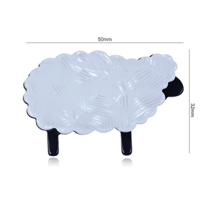 Detailed view of white acrylic sheep hair claw with 50mm by 32mm size markings