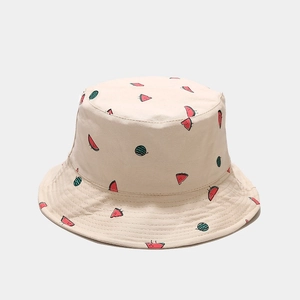 Close-up of beige cotton bucket hat with cute hand-drawn watermelon embroidery patterns
