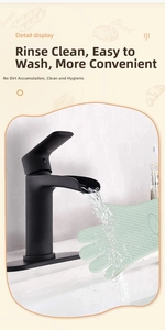 Detail view of light green silicone oven glove with non-slip texture under running water