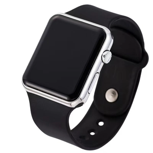 Detail of a sleek black silicone strap and silver metal frame of a modern LED digital watch