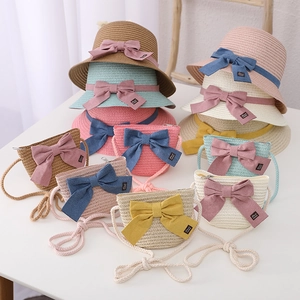 Girls straw sun hat and matching purse set with decorative bow and handmade label