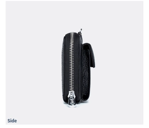 Side view of black pebble leather phone crossbody bag with silver zipper and pocket