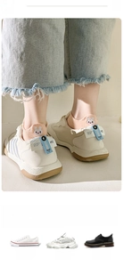 Detail of peach cotton ankle sock featuring cute white bunny embroidery on the heel