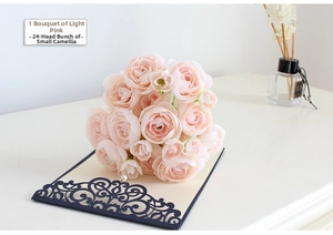 Close-up of a light pink artificial camellia bouquet with 24 flower heads for home decor