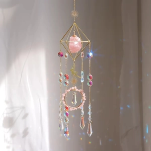 Golden butterfly suncatcher with raw pink crystal and multifaceted prisms for window decor