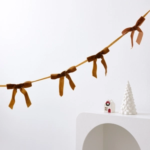 Caramel velvet bow garland decoration for Christmas trees and festive home interiors