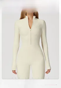 Detailed view of women's thermal yoga jumpsuit featuring quarter zipper and thumbhole cuffs