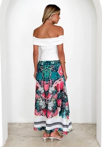 Rear view of long high-waisted floral skirt and white off-shoulder top set
