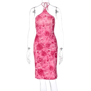 Detail of a slim fit pink floral midi sundress with halter neck on a clear mannequin
