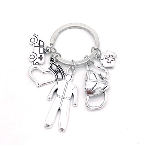 Detailed view of alloy medical keychain with ambulance, N95 mask, and nurse charms