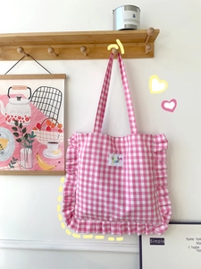 Pink checkered ruffle tote bag with floral edges and 'fun fun party' tag for daily use
