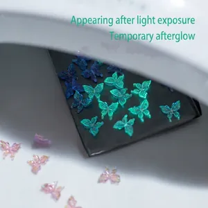 Luminous 3D butterfly nail charms in resin, showing day and night glowing effect