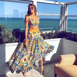 Detail of Mediterranean print two-piece set featuring crop top and maxi skirt on terrace
