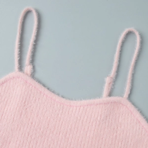 Close-up of pink fuzzy knit camisole showing soft plush texture and delicate straps